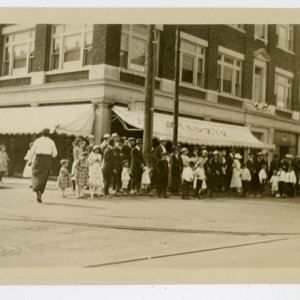 Crowd in front of the Staryzk Building watching a Parade